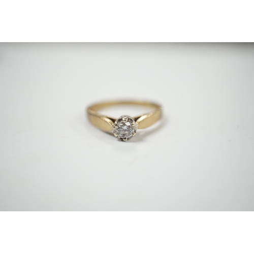 986 - A yellow metal and solitaire diamond set ring, size N/O, gross weight 2.4 grams.