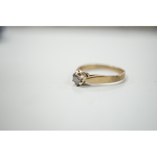 986 - A yellow metal and solitaire diamond set ring, size N/O, gross weight 2.4 grams.