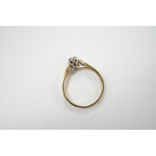 986 - A yellow metal and solitaire diamond set ring, size N/O, gross weight 2.4 grams.