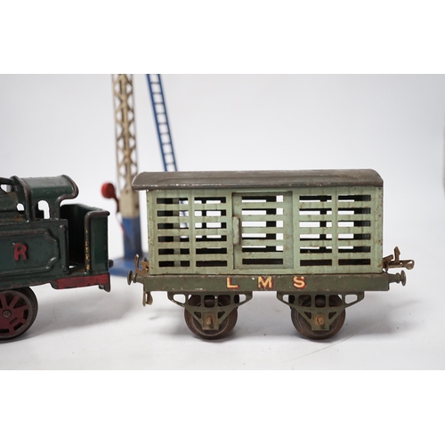 1266 - A collection of O gauge clockwork tinplate model railway, including a cast iron clockwork, GNR, 0-4-... 