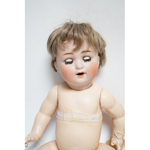 1314 - A Schutzmeister & Quendt bisque character doll, German, circa 1920 impressed 201, entwined SQ 6, wit... 