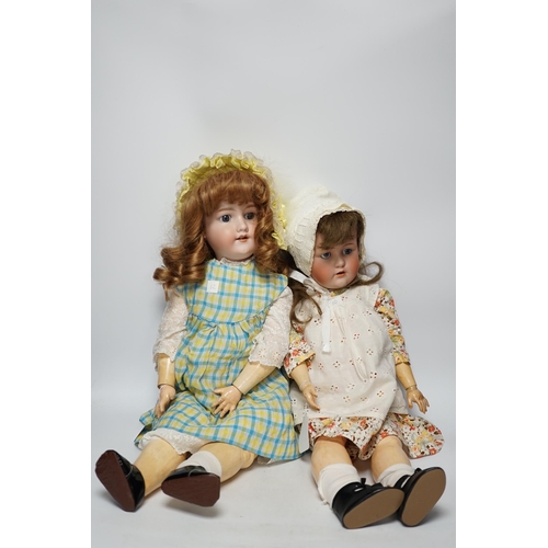 1317 - A Kestner JDK 168 bisque doll, 65cm and an AM390 doll with bisque head, 65cm