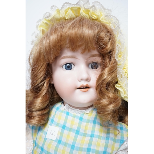 1317 - A Kestner JDK 168 bisque doll, 65cm and an AM390 doll with bisque head, 65cm