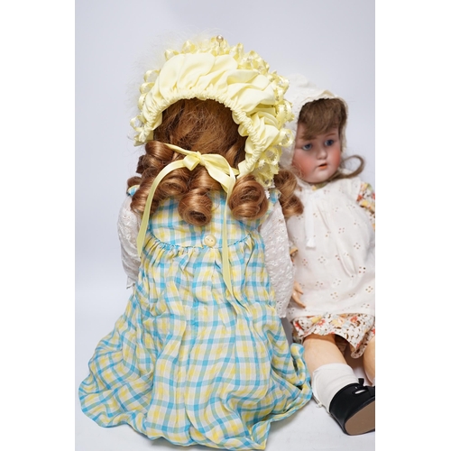 1317 - A Kestner JDK 168 bisque doll, 65cm and an AM390 doll with bisque head, 65cm