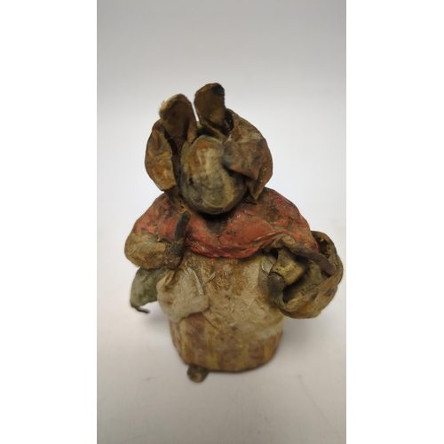 1329 - An F. Warne papier-mâché Beatrix Potter figure of Mrs. Rabbit with basket and umbrella, red and whit... 