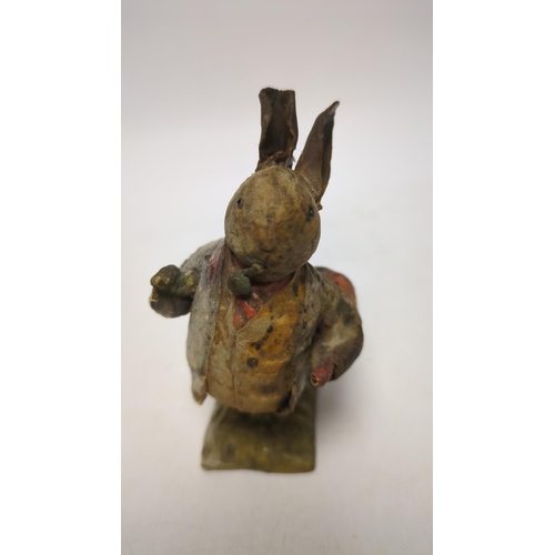 1330 - An F. Warne papier-mâché Beatrix Potter figure of Benjamin Bunny with pipe and red handkerchief bag,... 