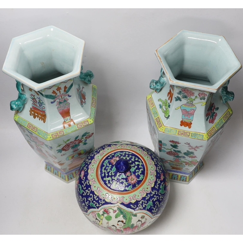 1383 - A pair of Chinese famille rose vases and a similar jar and cover, 38cm