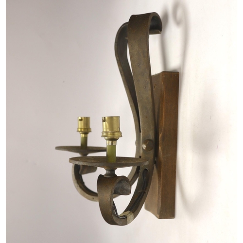 1384 - A pair of wrought iron two branch wall lights, height 33cm