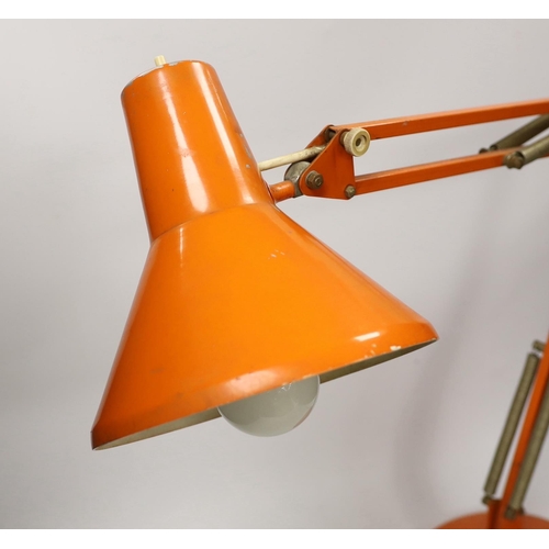 1392 - An orange Thousand and One Lamps Ltd angle poise lamp, approximately 76cm high