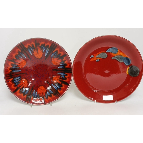 1399 - Three Poole Pottery Delphis wall plates, 25cm