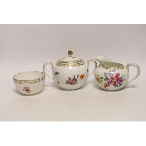 1408 - A Nymphenburg floral decorated teapot, milk jug and sugar bowl, teapot 13c high