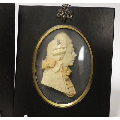 1411 - Attributed to Leslie Ray, pair of 20th century wax relief portraits of  a lady and gentleman wearing... 