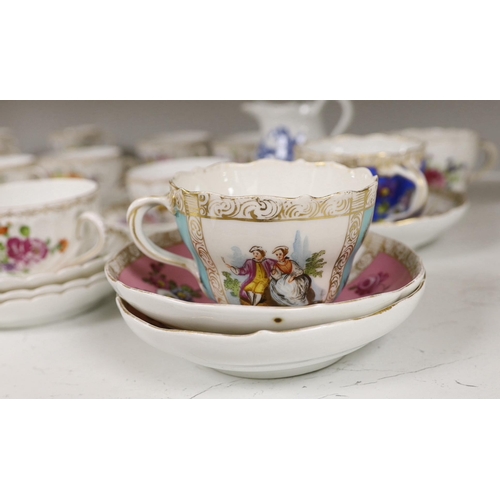 1413 - A group of porcelain Dresden tableware including cups and saucers and a blue and white jug