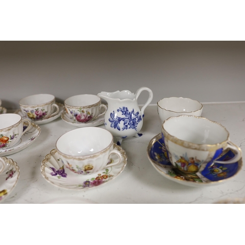 1413 - A group of porcelain Dresden tableware including cups and saucers and a blue and white jug