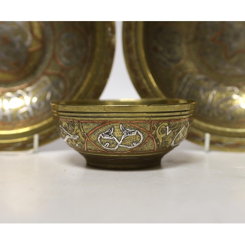 1442 - A pair and another inlaid brass dishes, Cairo ware, largest 19cm