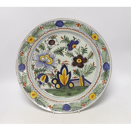 1444 - An 18th century Delft polychrome charger, 34cm