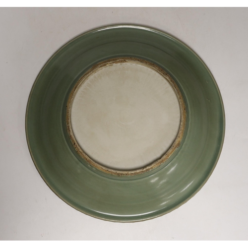 1455 - A large Chinese celadon glazed  plate, 30cm