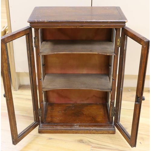 1471 - A small early 20th century glazed oak and pine two door shop display cabinet, 65.5 x 45 x 26cm... 