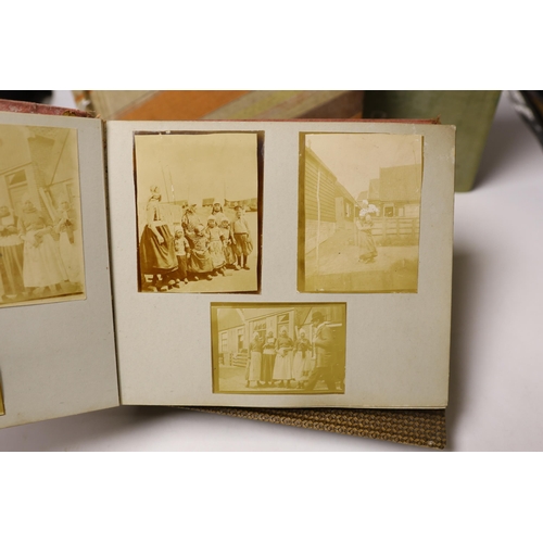 1496 - Three albums of Edwardian and later postcards and two early 20th century photograph albums, predomin... 