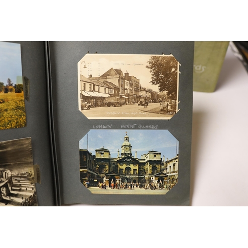 1496 - Three albums of Edwardian and later postcards and two early 20th century photograph albums, predomin... 