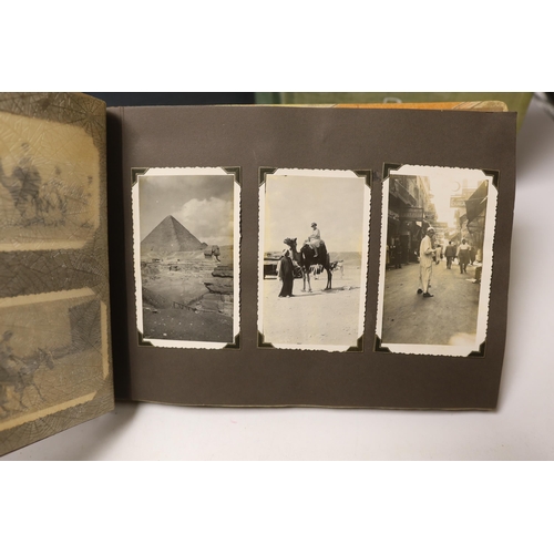 1496 - Three albums of Edwardian and later postcards and two early 20th century photograph albums, predomin... 