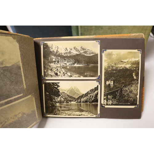 1496 - Three albums of Edwardian and later postcards and two early 20th century photograph albums, predomin... 