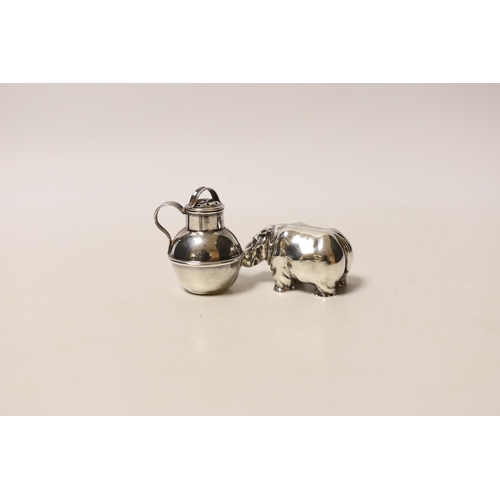 1859 - A modern silver miniature model of a hippopotamus, a white metal 'Guernsey can' pepperette and a par... 