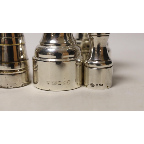 1865 - Three assorted modern silver pepper mills, largest 10.5cm and one plated pepper mill.