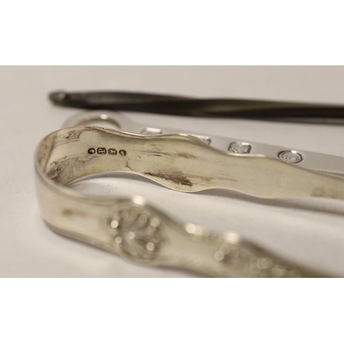 1866 - Two pairs of silver sugar tongs, including Victorian King's pattern a white metal toddy ladle and a ... 