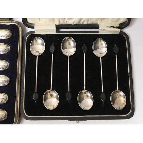 1873 - A cased set of six 1930's silver bean end coffee spoons, Birmingham, 1931 and a cased set of six han... 