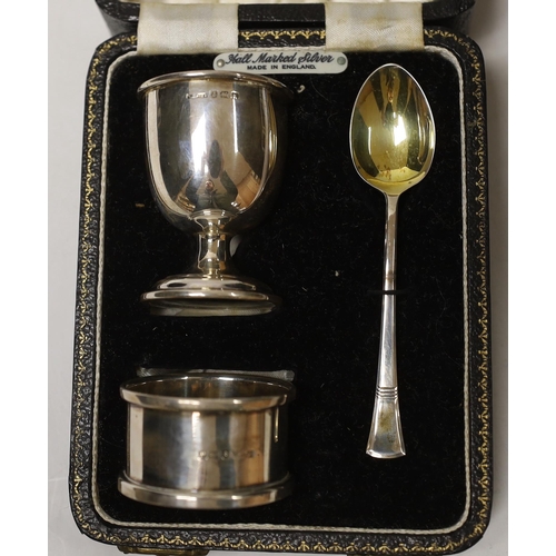 1875 - A cased George VI silver christening egg cup, spoon and napkin ring, Birmingham, 1946/7.