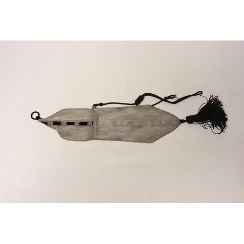 1882 - A 1920's silver mesh and black sash with tassel mounted evening bag, with black suspension cord, imp... 