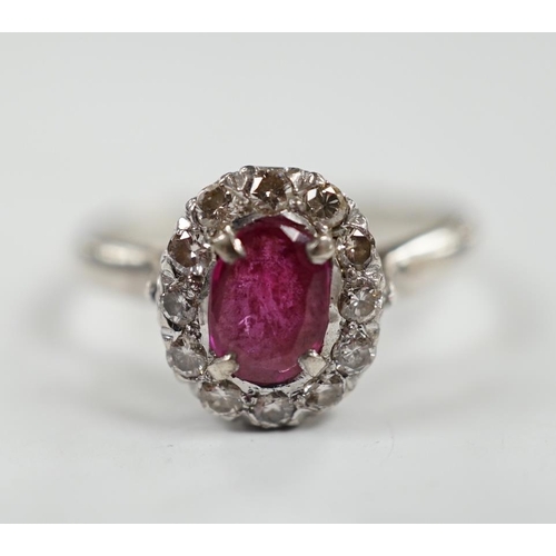 1934 - A white metal, synthetic? ruby and diamond set oval cluster ring, size P, gross weight 3.3 grams.... 