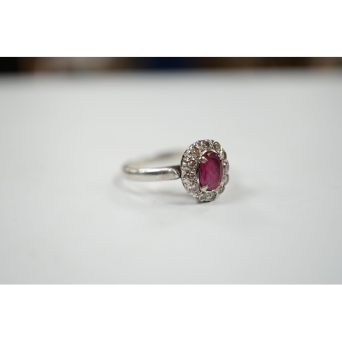 1934 - A white metal, synthetic? ruby and diamond set oval cluster ring, size P, gross weight 3.3 grams.... 