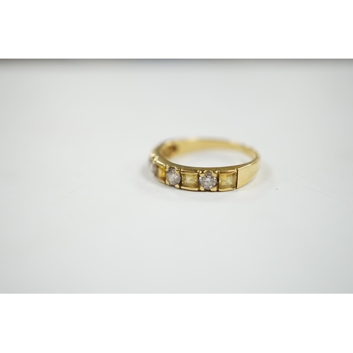 1939 - A yellow metal, five stone square cut yellow sapphire and four stone round cut diamond set half hoop... 