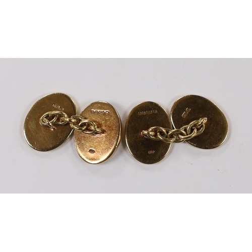 1943 - A pair of 1980's heavy 9ct gold oval cufflinks, with engraved crests, 16.2 grams.