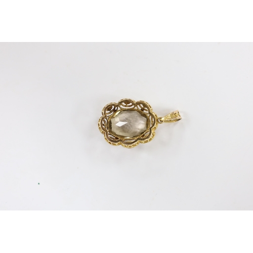 1946 - A 9ct gold and single stone oval cut pale smoky quartz set pendant, 50mm, gross weight 12.7 grams.... 