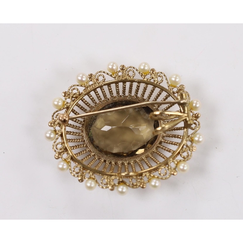 1958 - A Zeeta 9ct and oval cut yellowy brown quartz set pendant brooch, with cultured pearl set border, 46... 