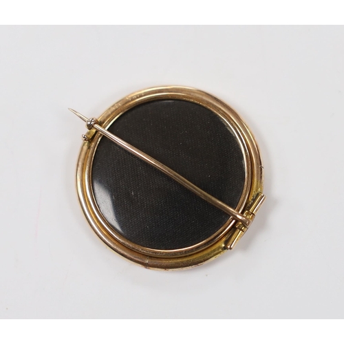 1963 - A 19th century yellow metal mounted circular brooch, with glazed back and inset miniature watercolou... 