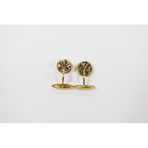 1977 - A pair of continental yellow metal overlaid circular cufflinks, of pierced foliate form, 14mm.... 