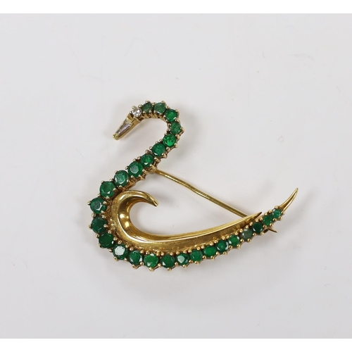 1979 - A late 1980's 18ct gold, emerald, and diamond cluster set brooch, modelled as a swan, with trapeze c... 