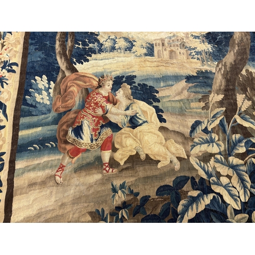 12 - A late 18th century Brussels Verdue figurative tapestry, depicting Royal lovers in a landscape with ... 