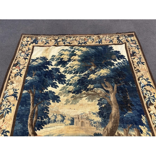 12 - A late 18th century Brussels Verdue figurative tapestry, depicting Royal lovers in a landscape with ... 