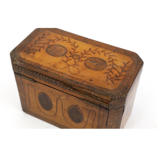 28 - A George III Sheraton style marquetry inlaid satinwood tea caddy of octagonal form with foliate swag... 