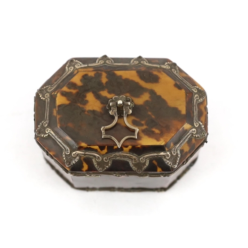 29 - A Victorian silver mounted blond tortoiseshell tea caddy of octagonal form with loop handle and scro... 