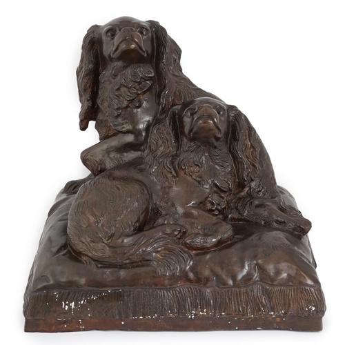 34 - After Charles Valton (French, 1851-1819), a bronze group of two King Charles spaniels seated upon a ... 