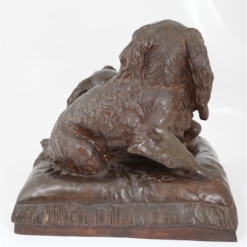 34 - After Charles Valton (French, 1851-1819), a bronze group of two King Charles spaniels seated upon a ... 