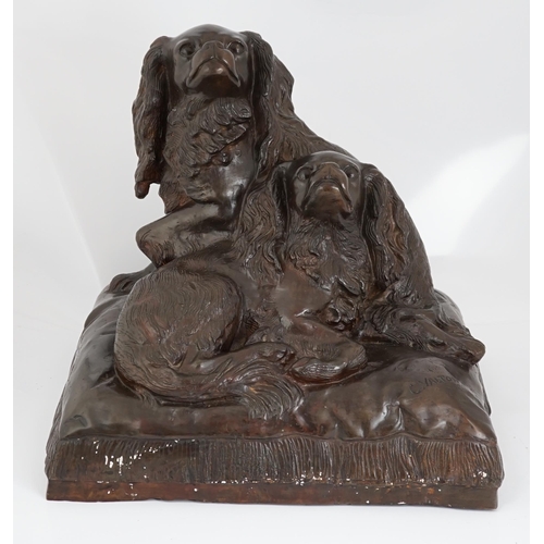 34 - After Charles Valton (French, 1851-1819), a bronze group of two King Charles spaniels seated upon a ... 