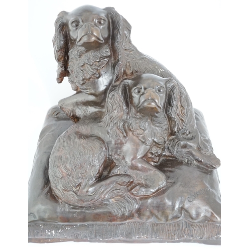 34 - After Charles Valton (French, 1851-1819), a bronze group of two King Charles spaniels seated upon a ... 