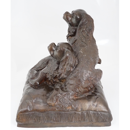 34 - After Charles Valton (French, 1851-1819), a bronze group of two King Charles spaniels seated upon a ... 